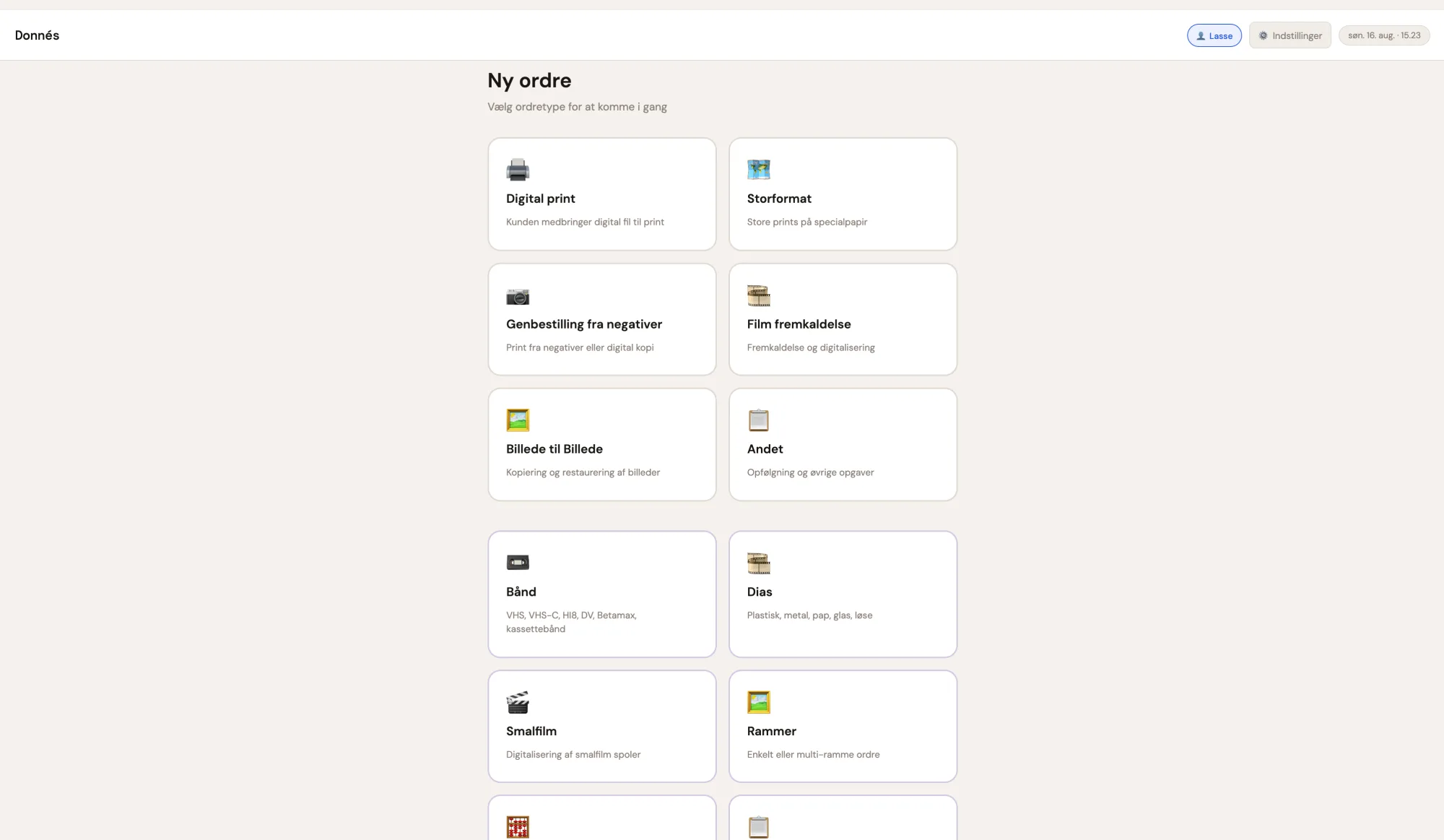 The home screen is the natural starting point for all staff. From here, the order type is selected — digital print, large format, film, negatives, Photo-to-Photo, or one of the other categories such as framing, slides, tapes, and Super 8 film. The staff member logs in with their name, which is automatically attached to the order. The most recent order is displayed in a bar at the bottom of the screen, making it easy to retrieve or reprint a receipt if the customer returns.